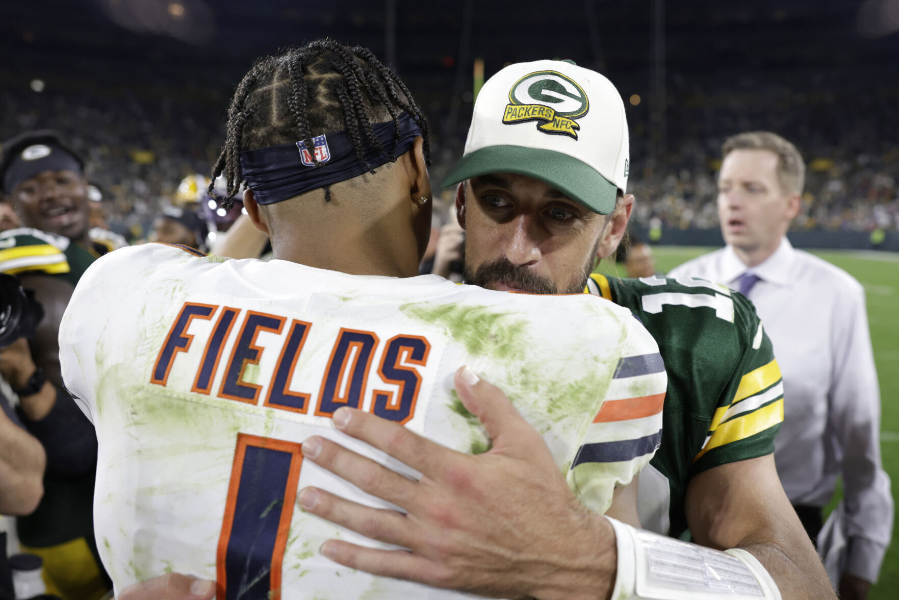 Aaron Rodgers, Justin Fields embrace after game, AP generic file photo